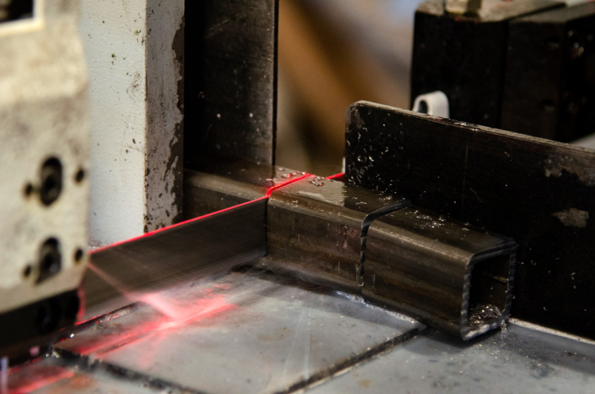 close up of machine laser cutting metal