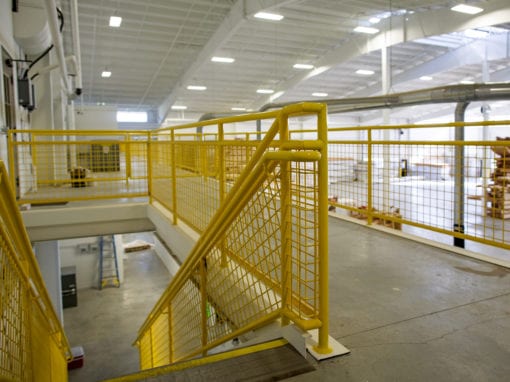 yellow metal stair railing in a big warehouse