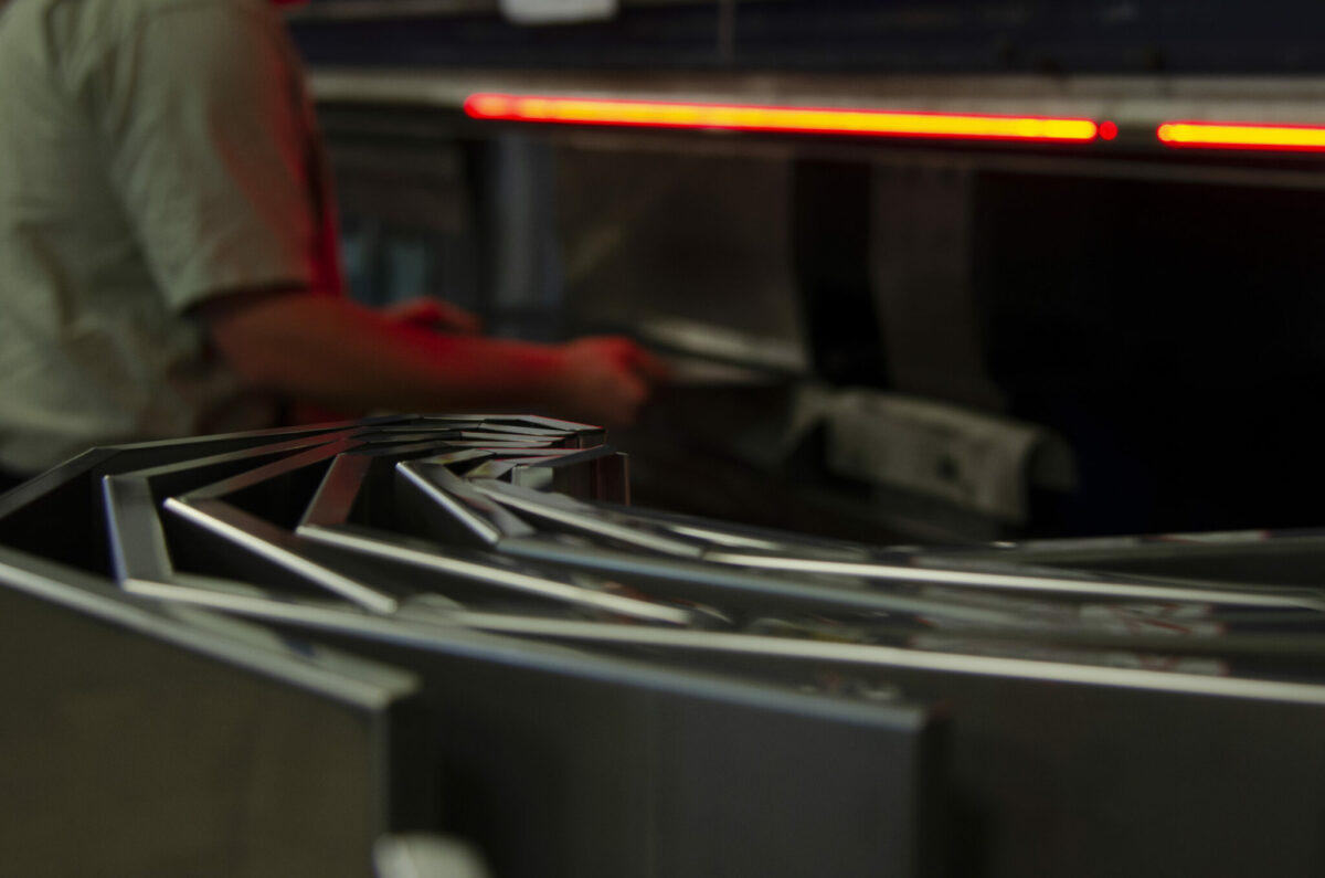 metal formed parts with a fabricator working in the background